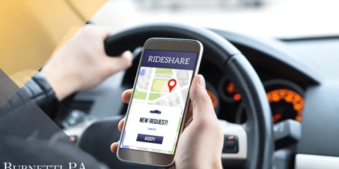 rideshare driver looking at app