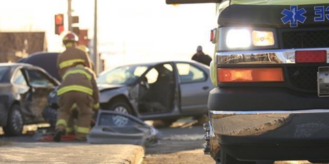 Two workers responding to a two-car accident