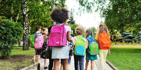 a group of school children with school bags