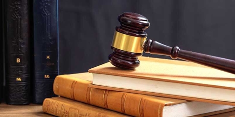 Gavel on top of some books