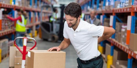 Man working while holding his back