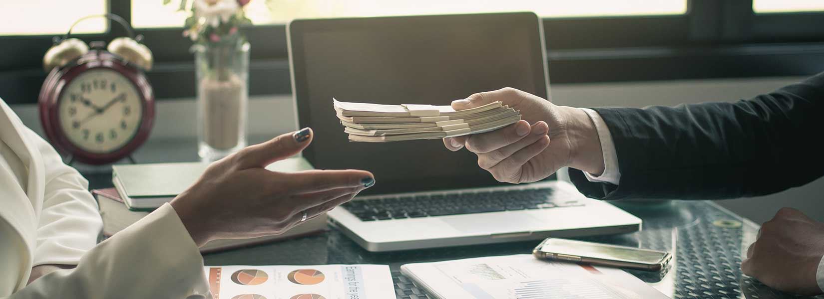 Two people exchanging money