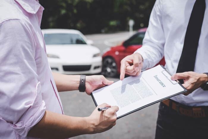 Men arguing after a car accident