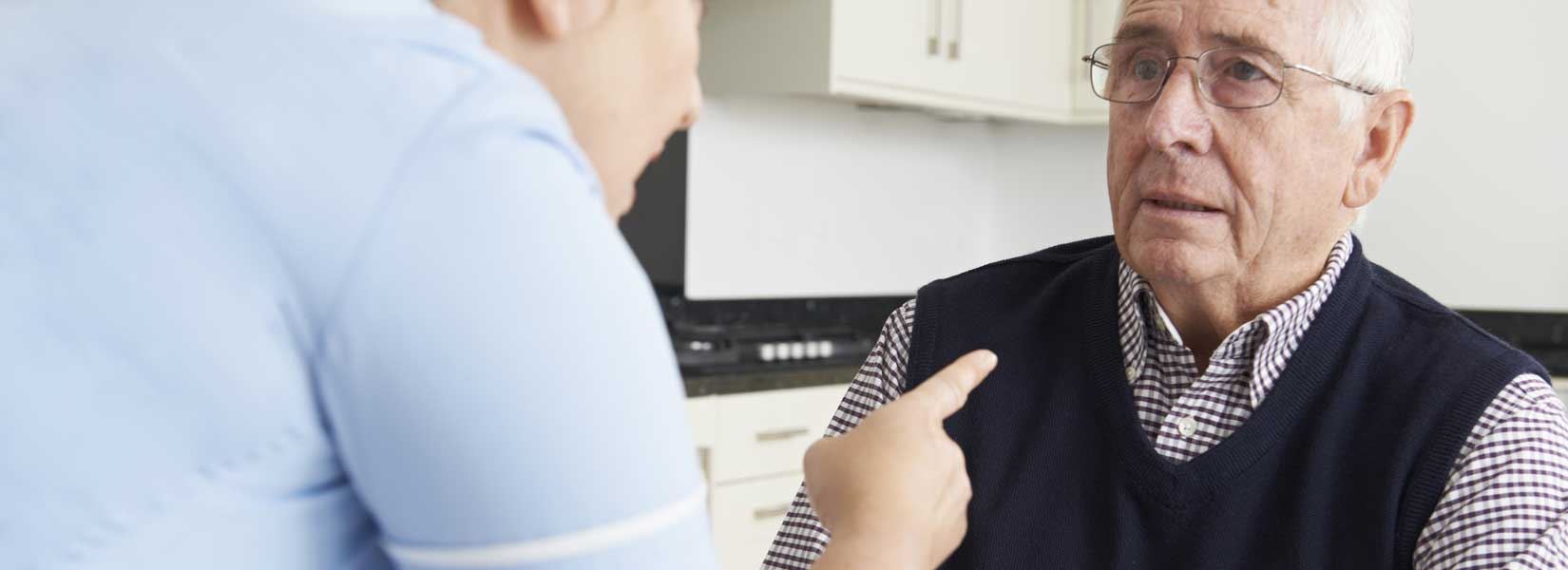 An elderly man being yelled at by a nursing home nurse