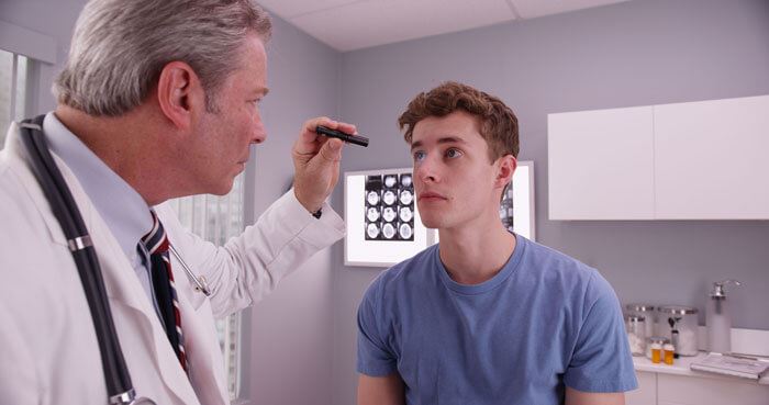 Doctor examining a patients eyes
