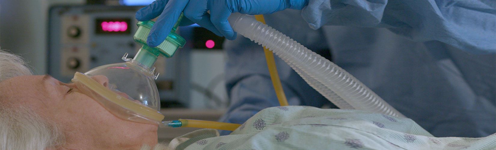 Older woman getting a breathing machine due to being sick