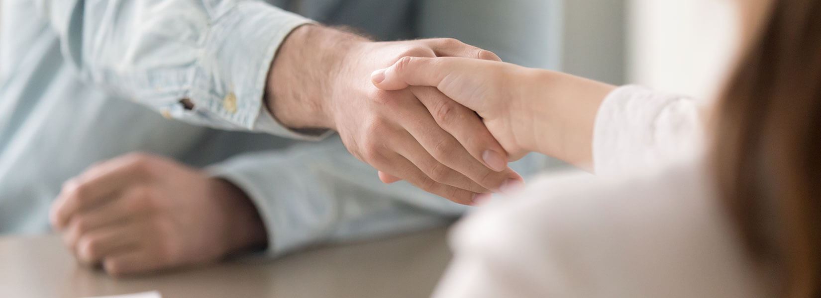 Two people shaking hands