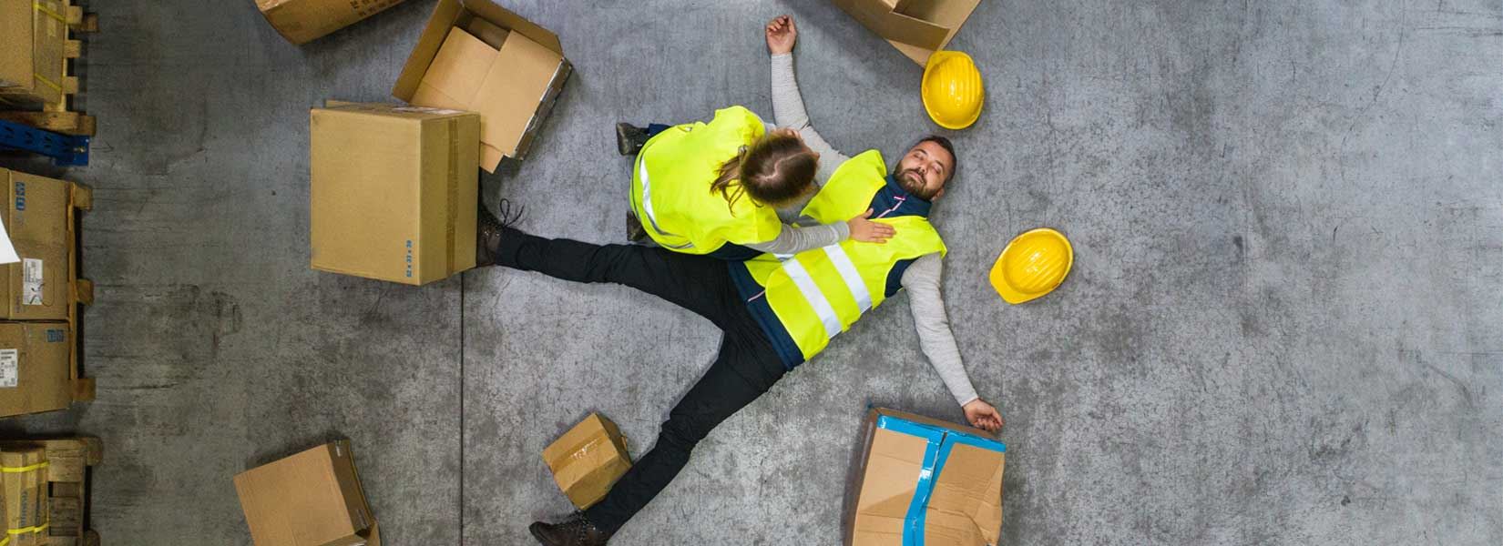 A construction worker on the ground after a fall