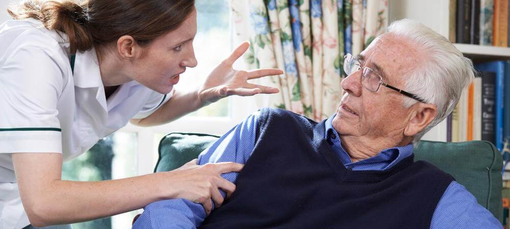 Mad woman holding elderly man's arm